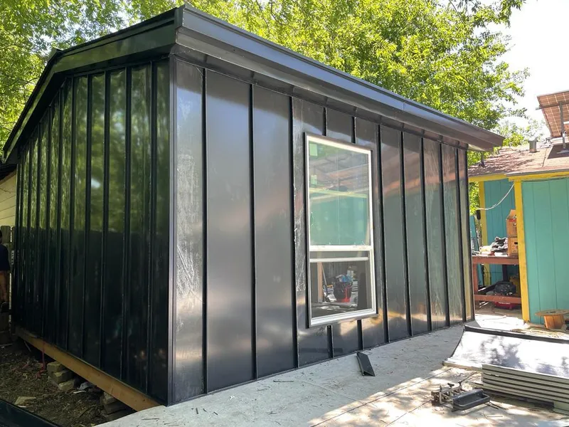 Black standing seam metal wall panels for Metal Roof Installation in Garner