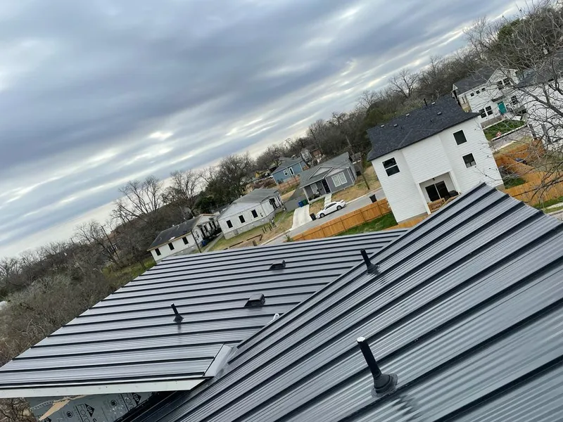 Standing seam metal roof panels with vents for Skylight Repair in Garner